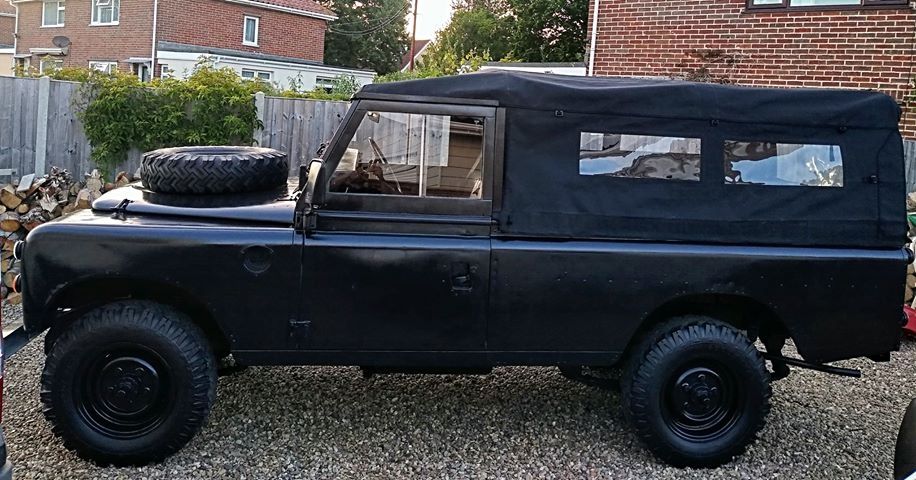 109 " full hood black canvas (wsw)