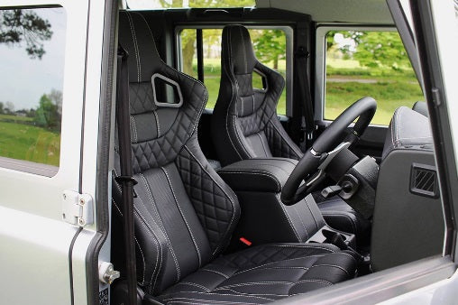 Front Leather Heated Corbeau Low Base Seats (OEM) - Suitable for Defender 90, 110 and 130 (plus Puma) vehicles